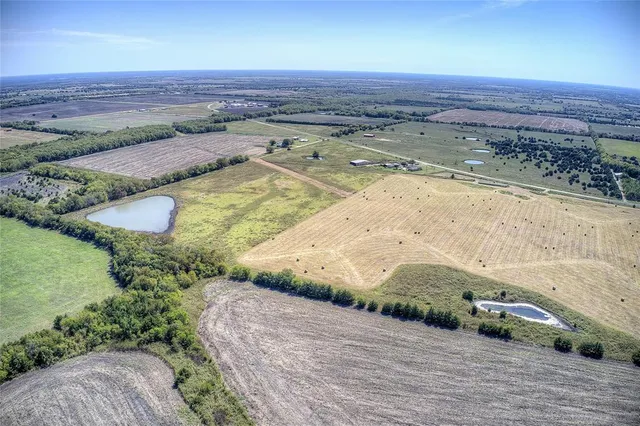 a view of a pool and a yard
