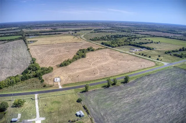 an aerial view of a backyard of a house