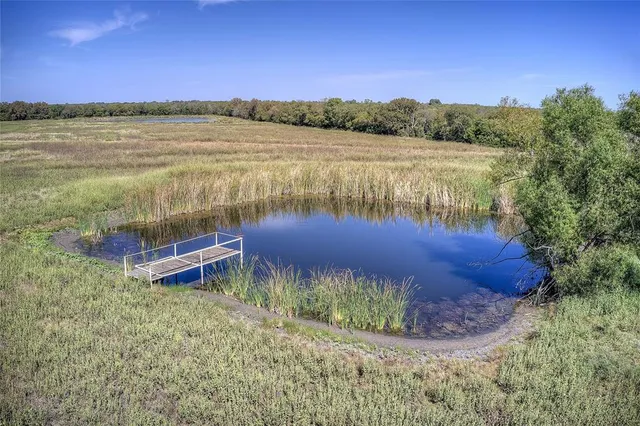 a view of a lake with a yard