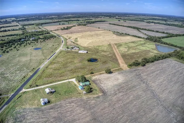 a view of a swimming pool with a yard