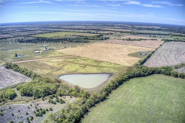 a view of a swimming pool and a yard