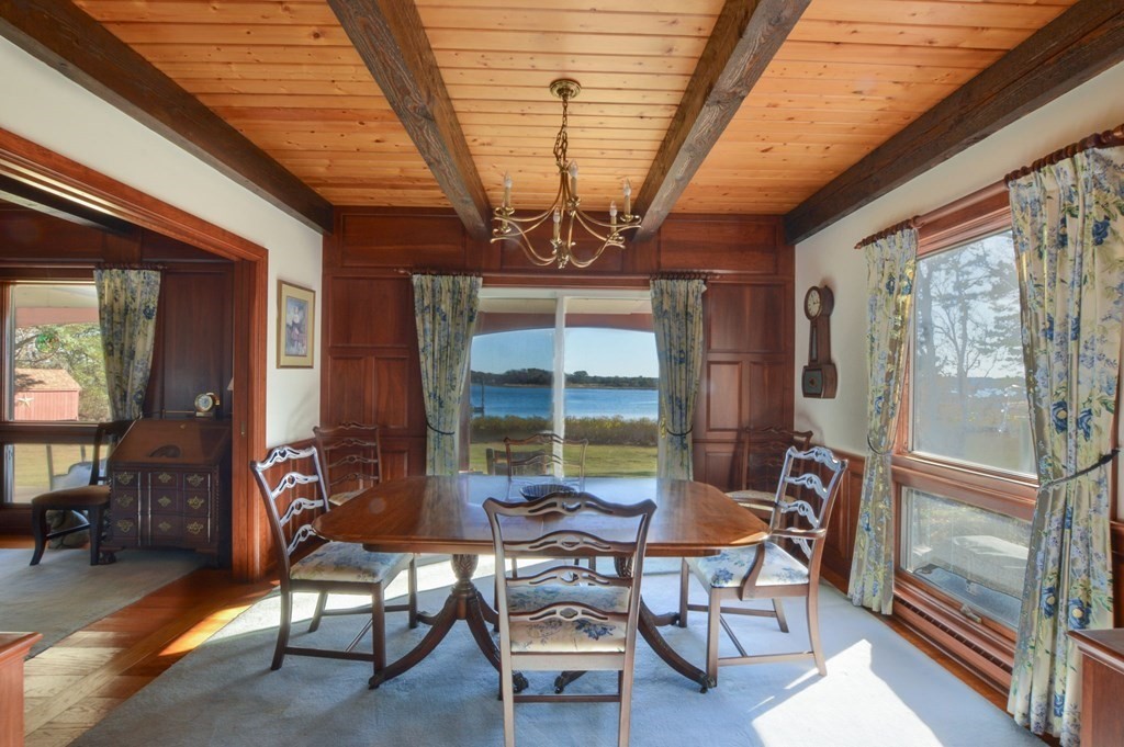 95 S Road Bourne, MA 02559 - Photo 11 of 33 a outdoor space with lots of chairs and a chandelier