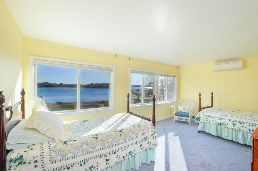 95 S Road Bourne, MA 02559 - Photo 16 of 33 a bedroom with a bed and large window