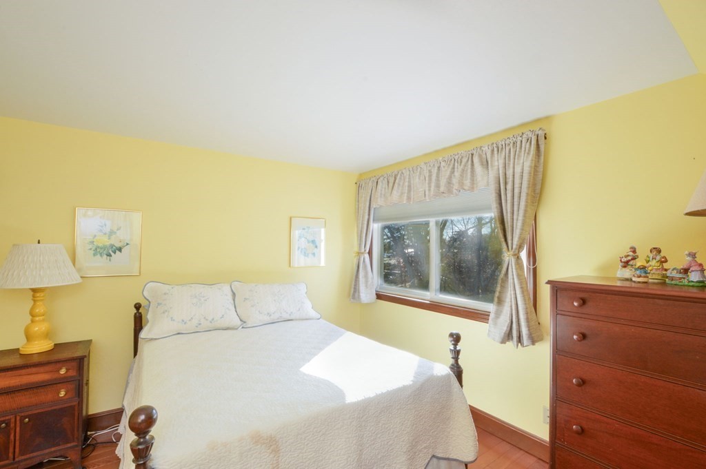 95 S Road Bourne, MA 02559 - Photo 20 of 33 a bedroom with a bed and a dresser