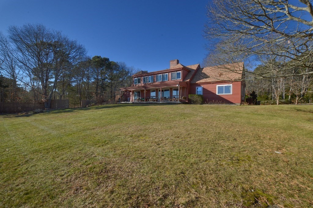 95 S Road Bourne, MA 02559 - Photo 24 of 33 a view of a building with a yard
