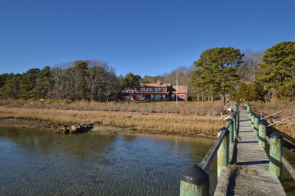 95 S Road Bourne, MA 02559 - Photo 3 of 33 a view of a water pond with green space