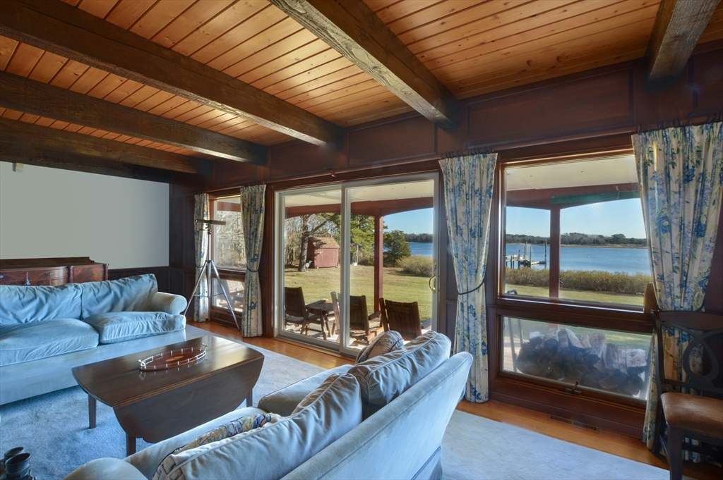 95 S Road Bourne, MA 02559 - Photo 8 of 33 a living room with furniture and a floor to ceiling window