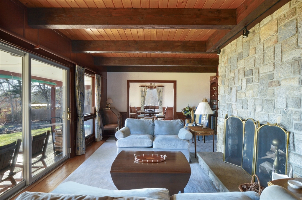 95 S Road Bourne, MA 02559 - Photo 9 of 33 a living room with furniture and a fireplace