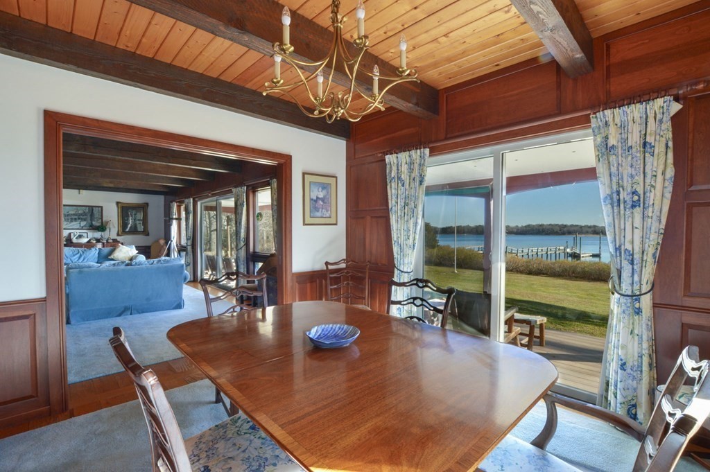 95 S Road Bourne, MA 02559 - Photo 10 of 33 a view of a dining room with furniture wooden floor and chandelier