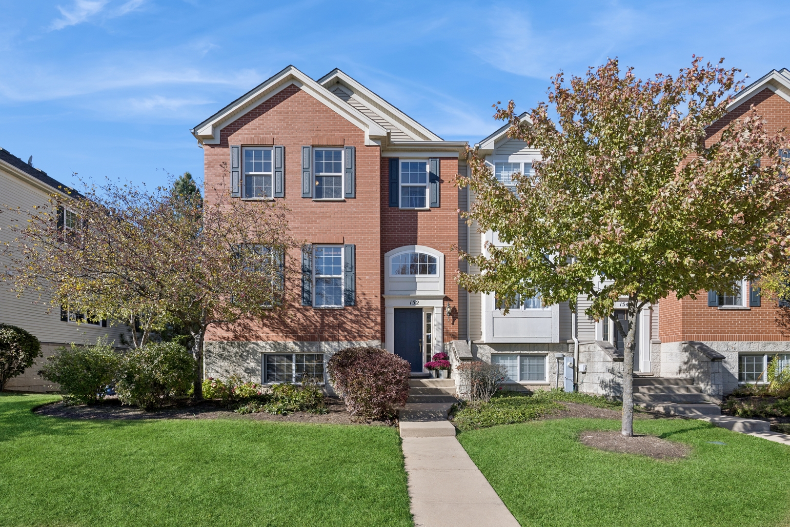 152 Jackson Street Gilberts, IL 60136 - Photo 1 of 31 a front view of a house with a garden and plants