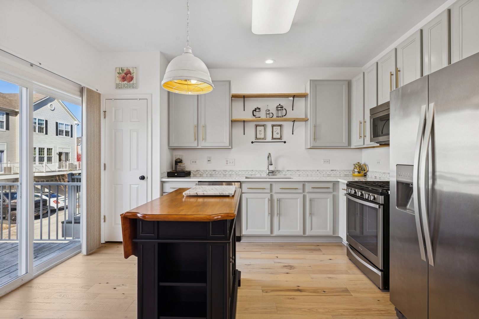 152 Jackson Street Gilberts, IL 60136 - Photo 9 of 31 a kitchen with stainless steel appliances granite countertop a refrigerator and a stove