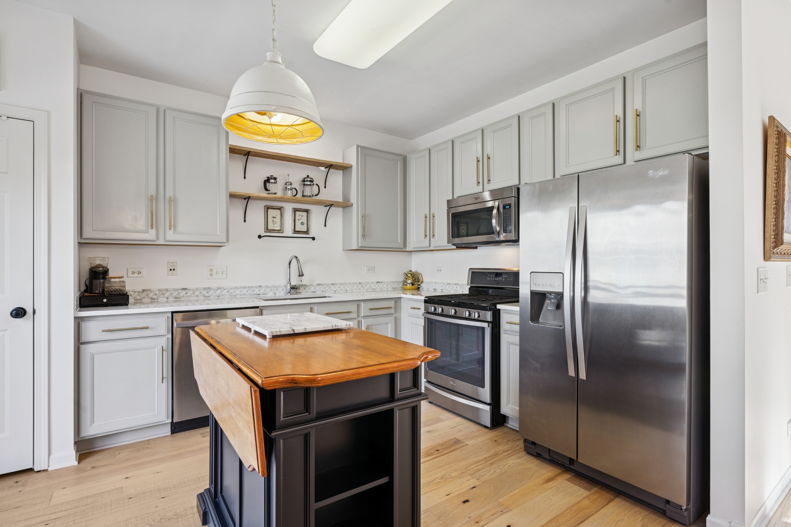 152 Jackson Street Gilberts, IL 60136 - Photo 10 of 31 a kitchen with stainless steel appliances granite countertop a refrigerator and a stove