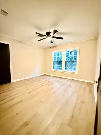a view of an empty room with a window
