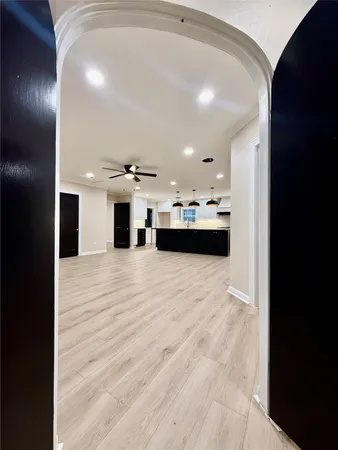 a view of an empty room with a fireplace