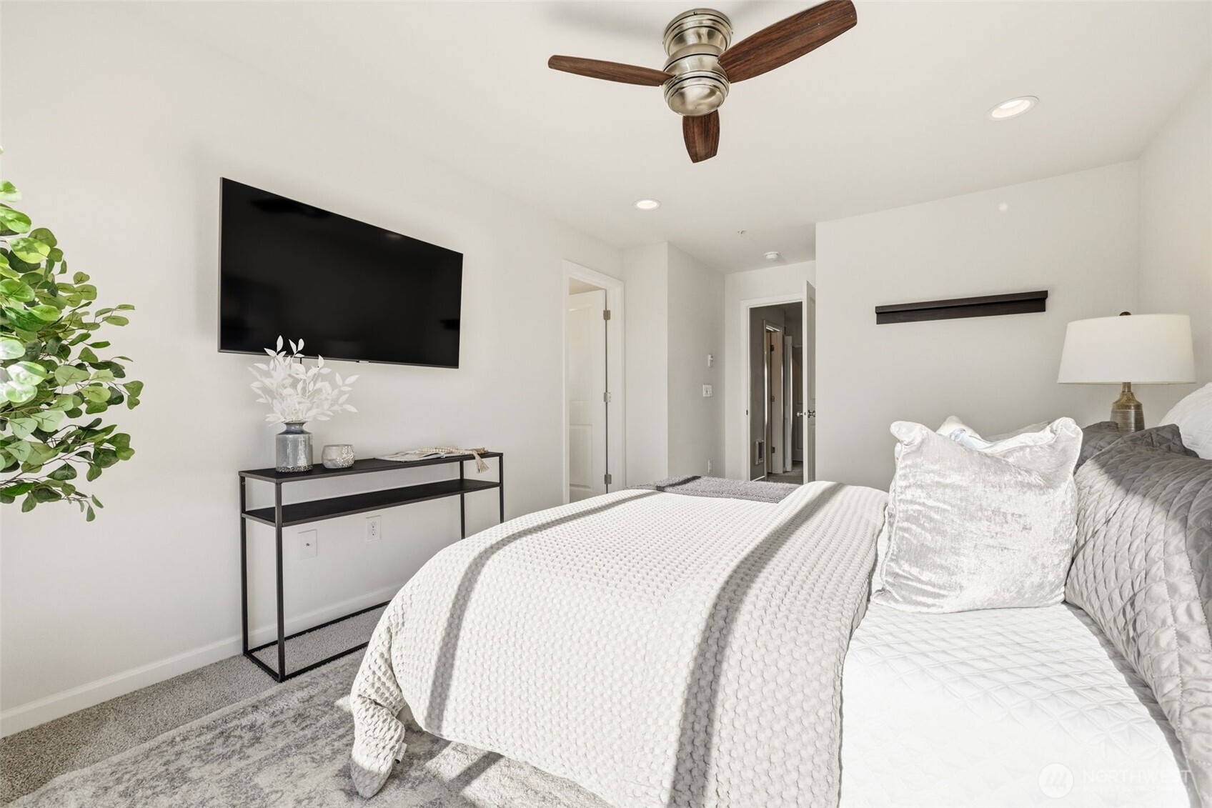 13125 83rd Lane South Seattle, WA 98178 - Photo 16 of 32 a bedroom with a bed and a flat screen tv