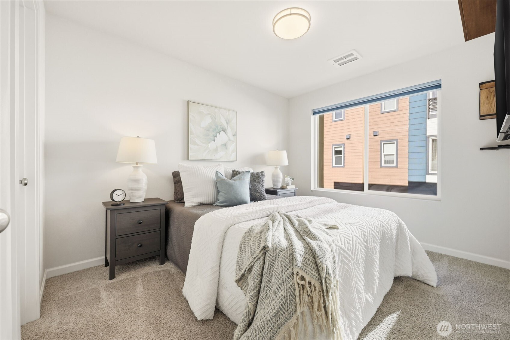 13125 83rd Lane South Seattle, WA 98178 - Photo 21 of 32 a spacious bedroom with a bed and window