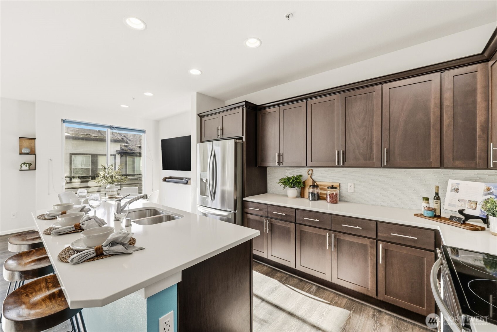 13125 83rd Lane South Seattle, WA 98178 - Photo 10 of 32 a kitchen with stainless steel appliances a sink stove and refrigerator