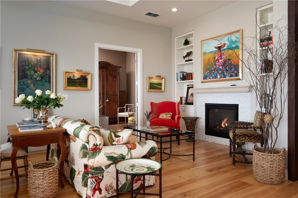 1650 Eucalyptus Road Nipomo, CA 93444 - Photo 14 of 60 a living room with furniture a fireplace and wall paintings