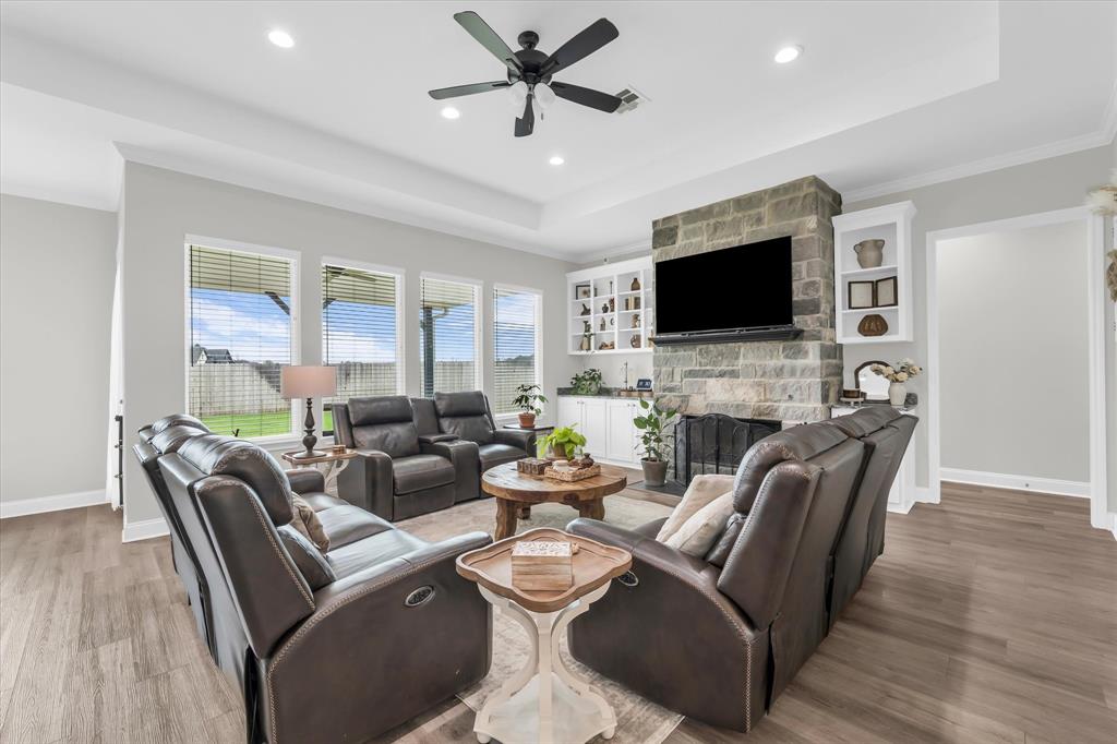 154 Water View Lane Robinson, TX 76706 - Photo 13 of 40 large windows for plenty of natural light, tall ceilings, built ins and stone fireplace in living room