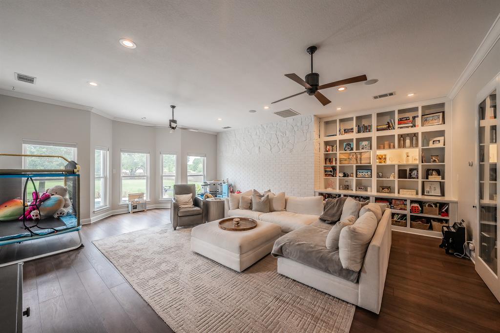 115 Pheasant Run Road Argyle, TX 76226 - Photo 22 of 40 a living room with furniture and a flat screen tv