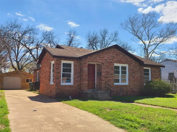 a front view of a house with yard