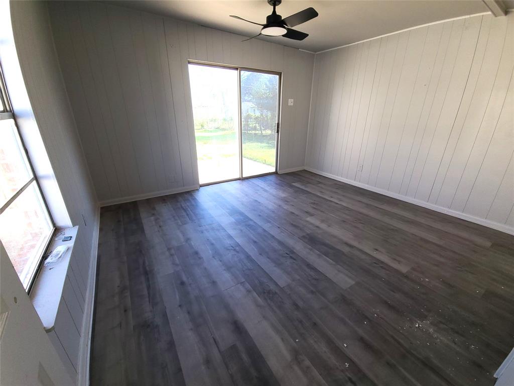 519 Dearborn Street Waco, TX 76704 - Photo 17 of 24 an empty room with wooden floor and windows