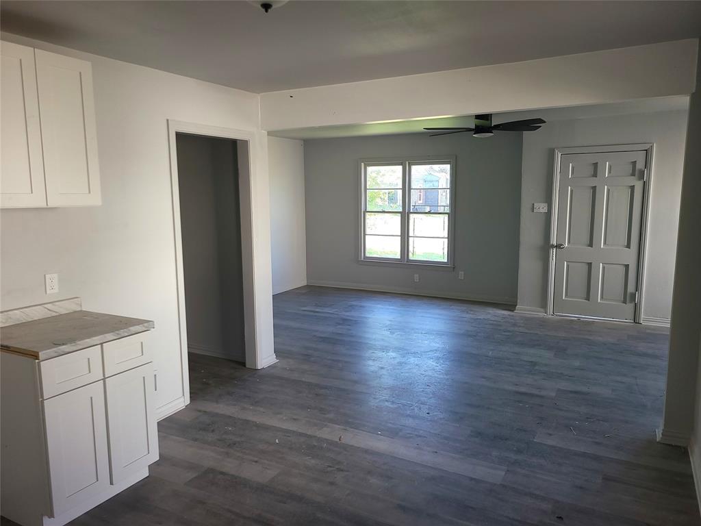 519 Dearborn Street Waco, TX 76704 - Photo 2 of 24 a view of a kitchen with wooden floor and a sink