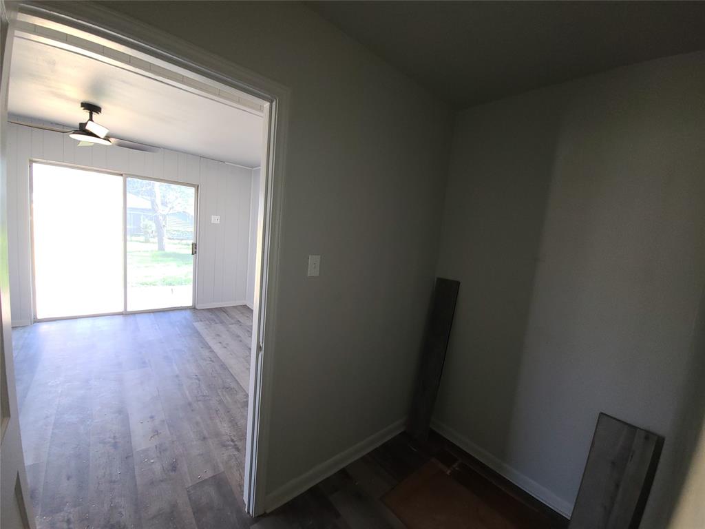 519 Dearborn Street Waco, TX 76704 - Photo 21 of 24 an empty room with wooden floor and windows