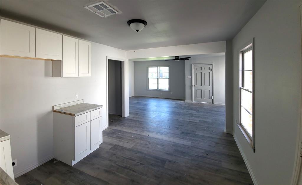 519 Dearborn Street Waco, TX 76704 - Photo 24 of 24 a kitchen with granite countertop a stove and a refrigerator