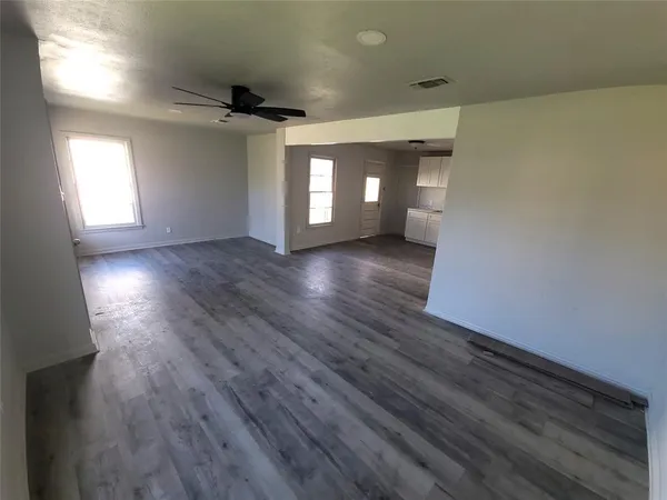 a kitchen with granite countertop a stove and a refrigerator