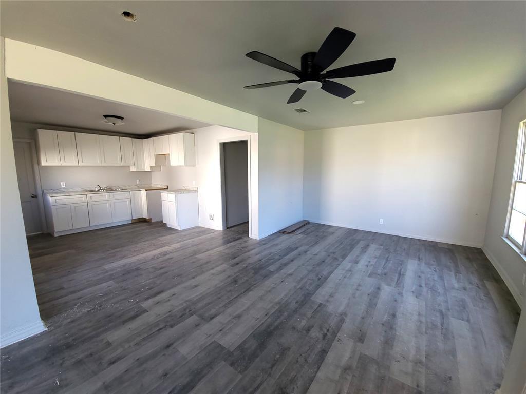 519 Dearborn Street Waco, TX 76704 - Photo 5 of 24 a view of empty room with wooden floor and window