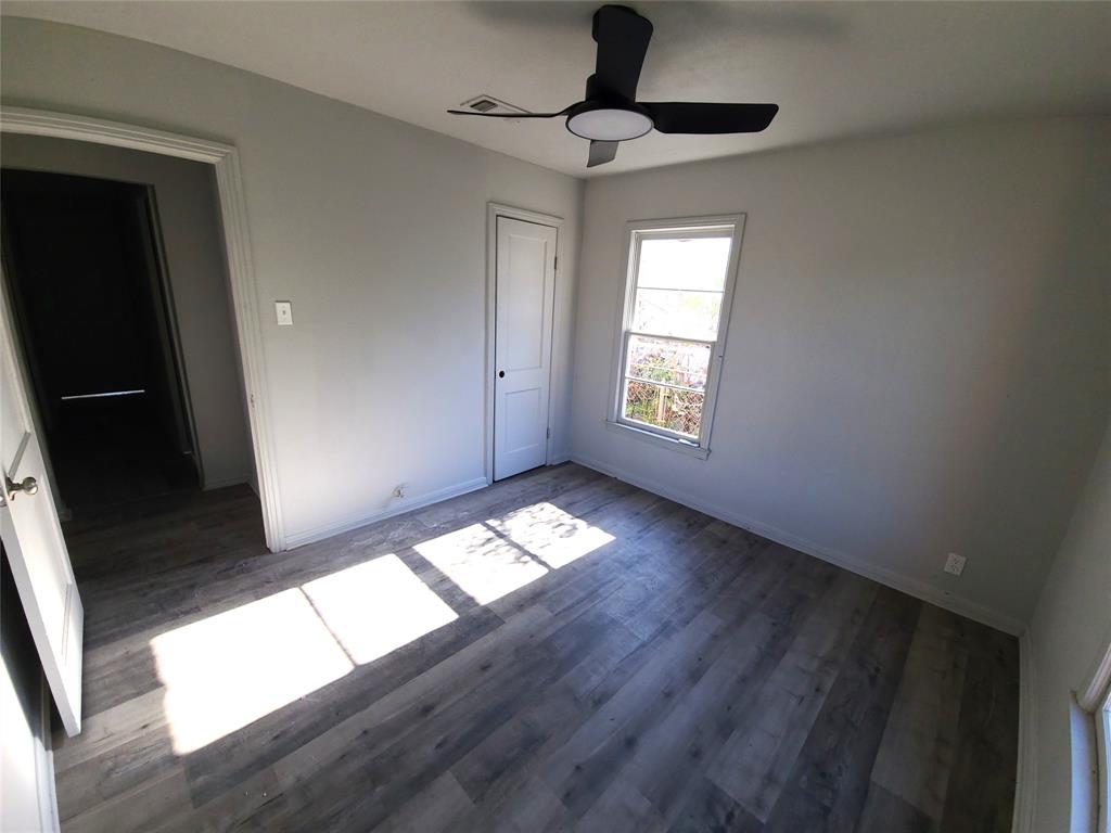 519 Dearborn Street Waco, TX 76704 - Photo 8 of 24 a view of empty room with wooden floor and window