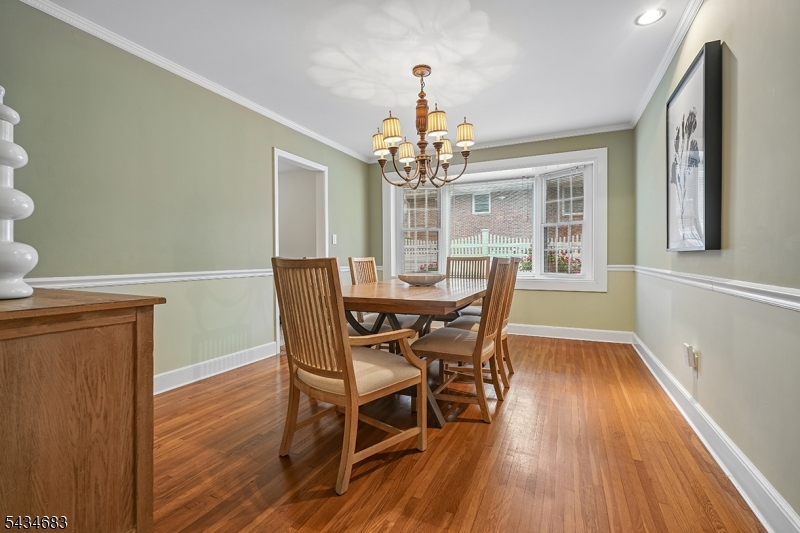 106 Division Avenue Summit, NJ 07901 - Photo 8 of 38 a view of a dining room with furniture wooden floor and chandelier