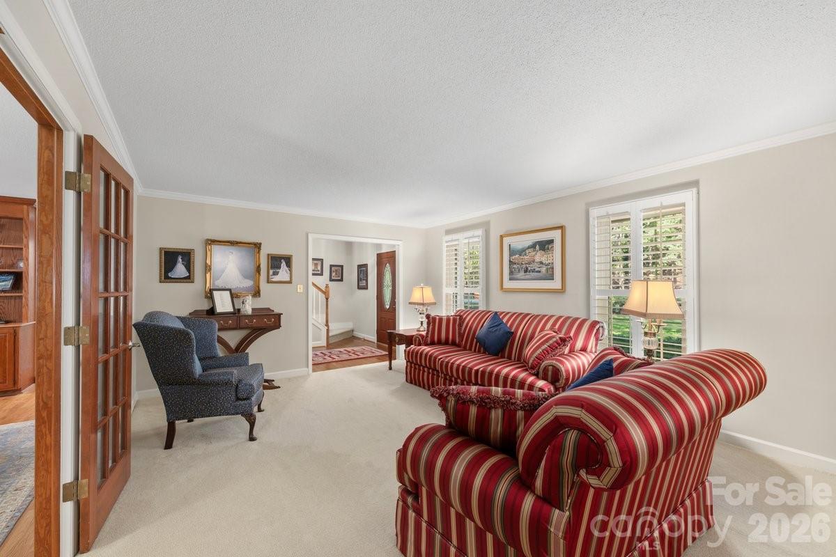 207 Lost Corner Road Morganton, NC 28655 - Photo 12 of 46 a living room with furniture a ceiling fan and a window