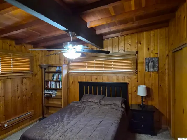 a view of a room with window and chandelier