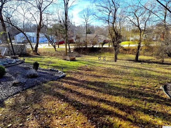 a view of outdoor sitting space with plants and outdoor seating