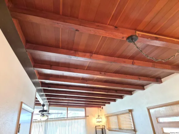 a view of a livingroom with furniture and window