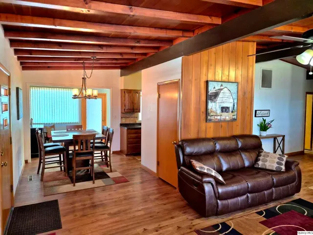 a view of a dining room with furniture and window