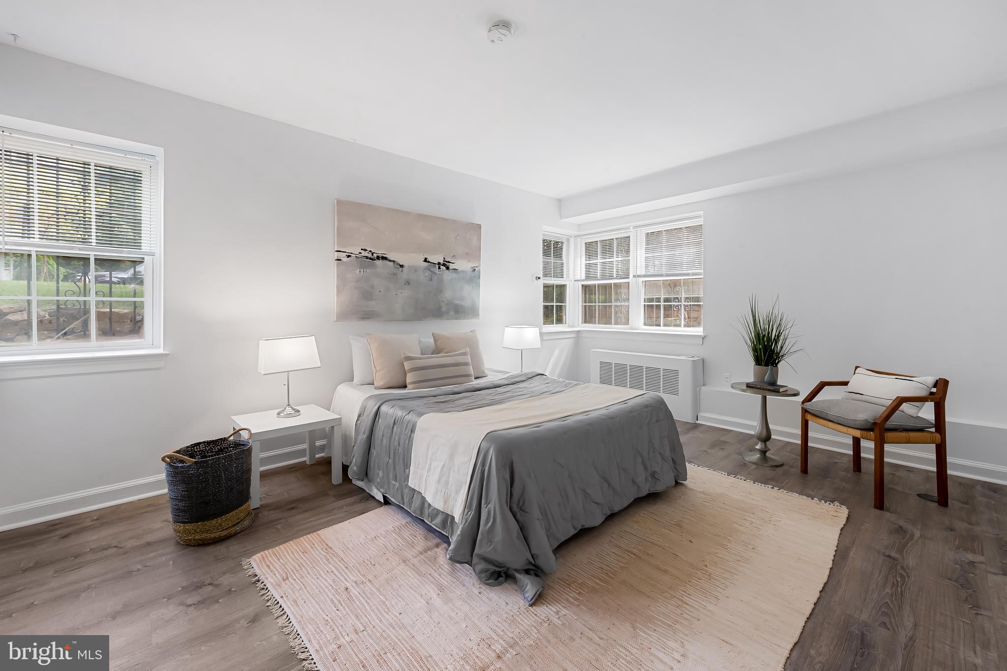 3601 Greenway, Unit 1 Baltimore, MD 21218 - Photo 16 of 29 a bedroom with a bed and wooden floor