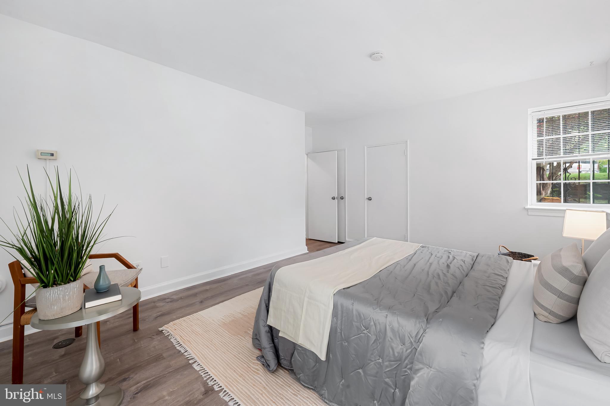 3601 Greenway, Unit 1 Baltimore, MD 21218 - Photo 17 of 29 a bedroom with a bed and wooden floor