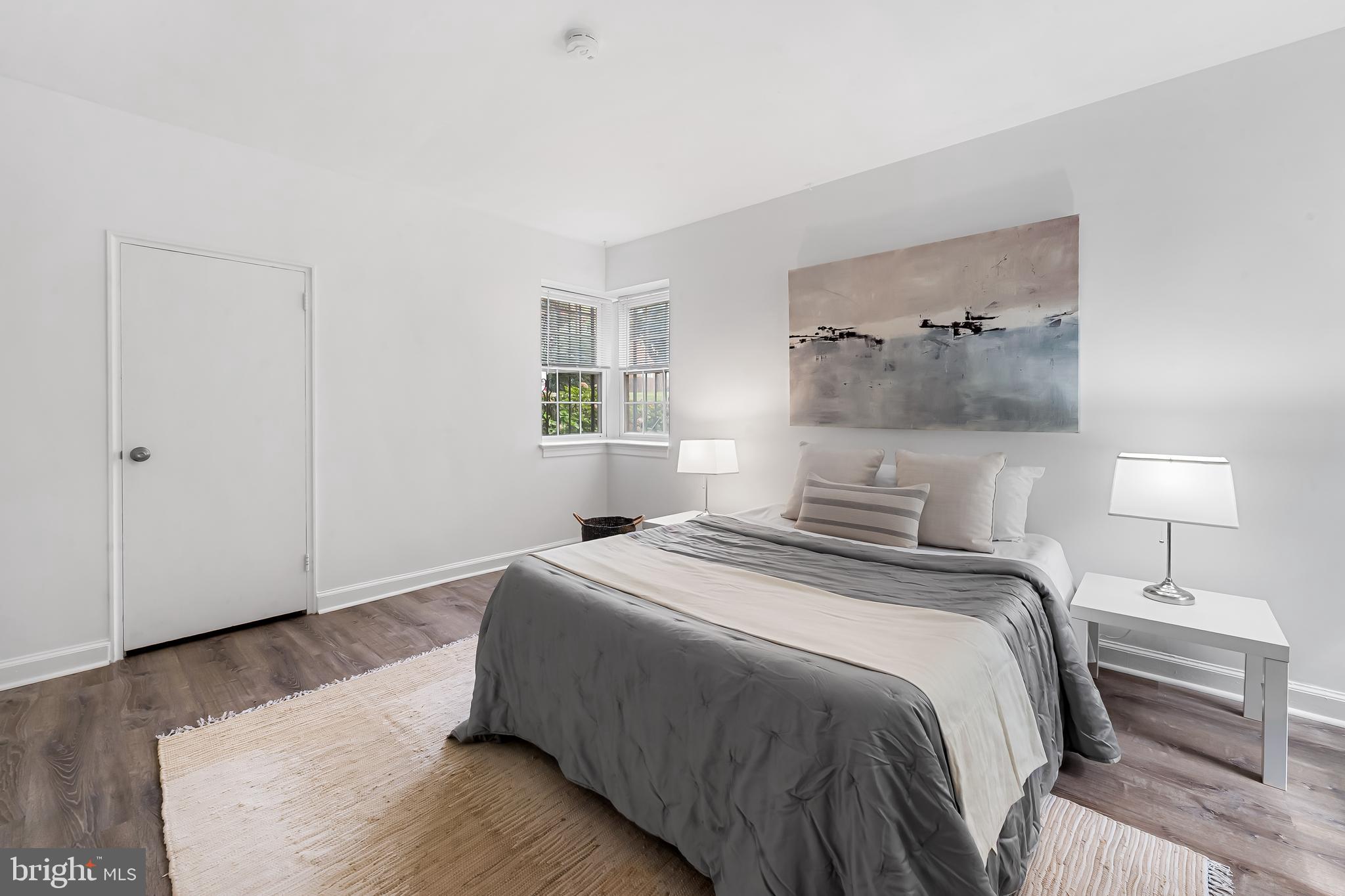 3601 Greenway, Unit 1 Baltimore, MD 21218 - Photo 18 of 29 a bedroom with a bed and a night stand