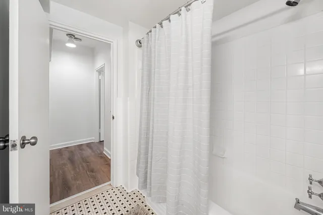 a bathroom with a shower and a toilet