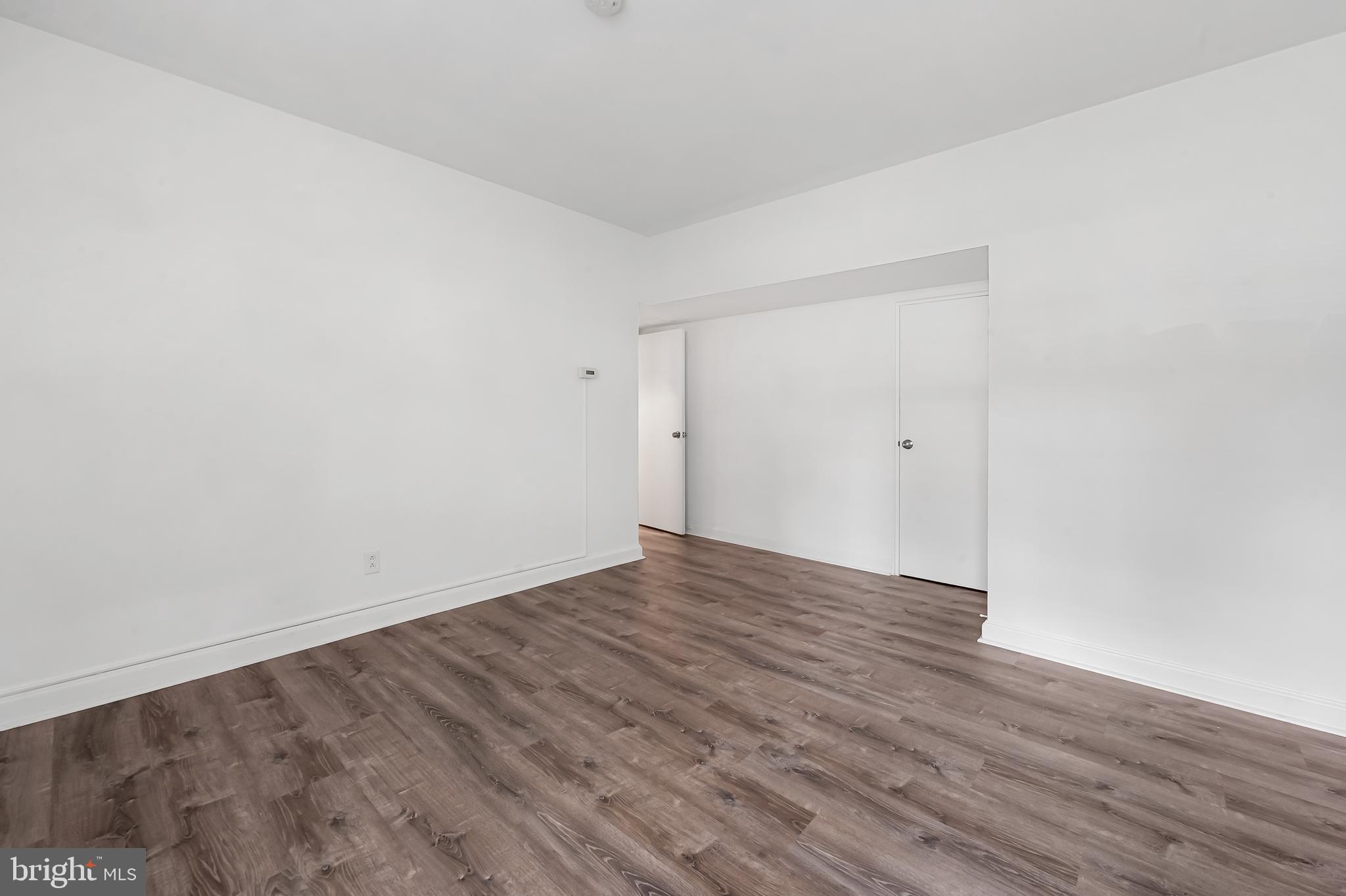 3601 Greenway, Unit 1 Baltimore, MD 21218 - Photo 22 of 29 a view of an empty room with wooden floor