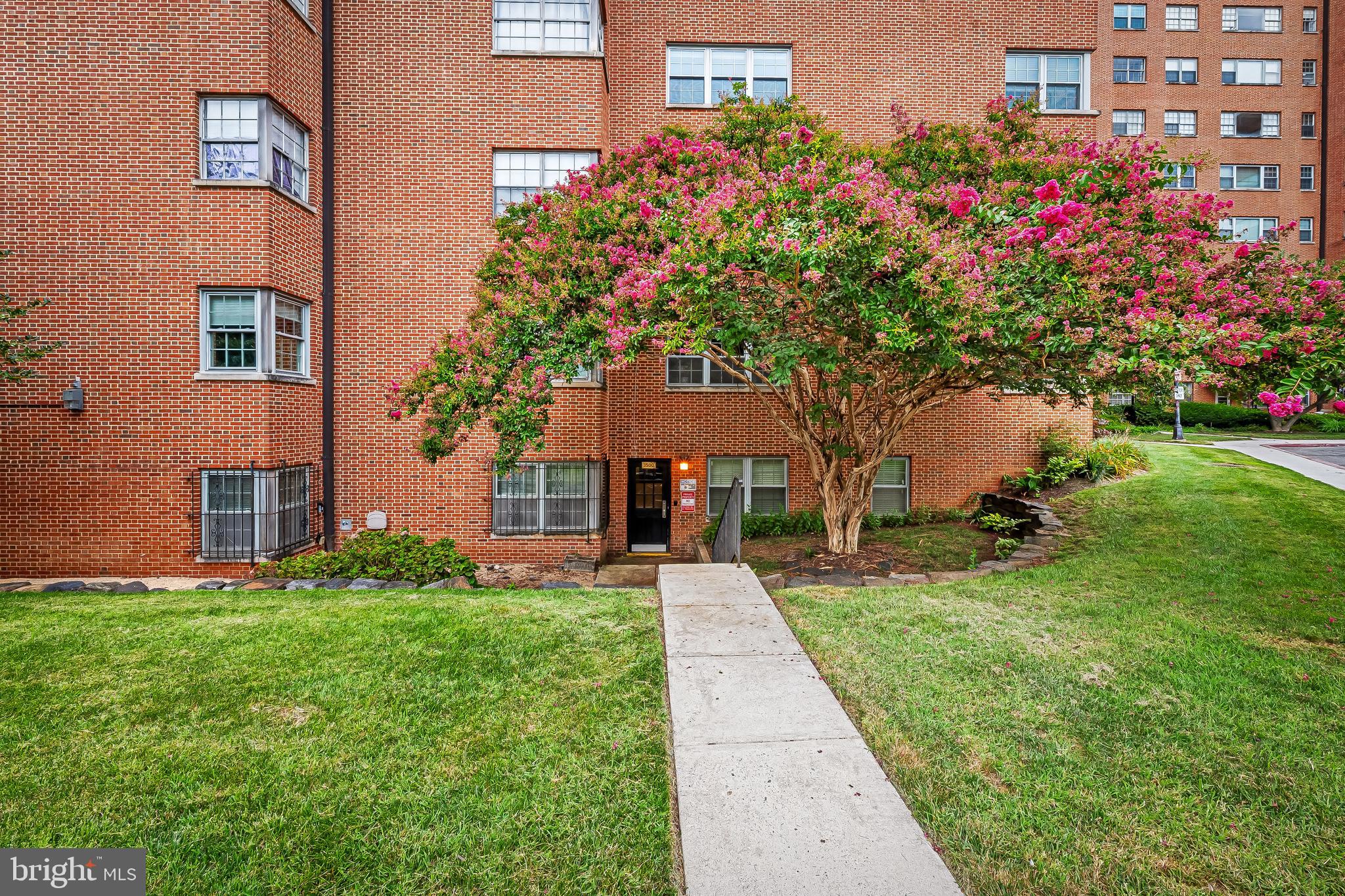 3601 Greenway, Unit 1 Baltimore, MD 21218 - Photo 24 of 29 a front view of a house with a yard and fountain in middle