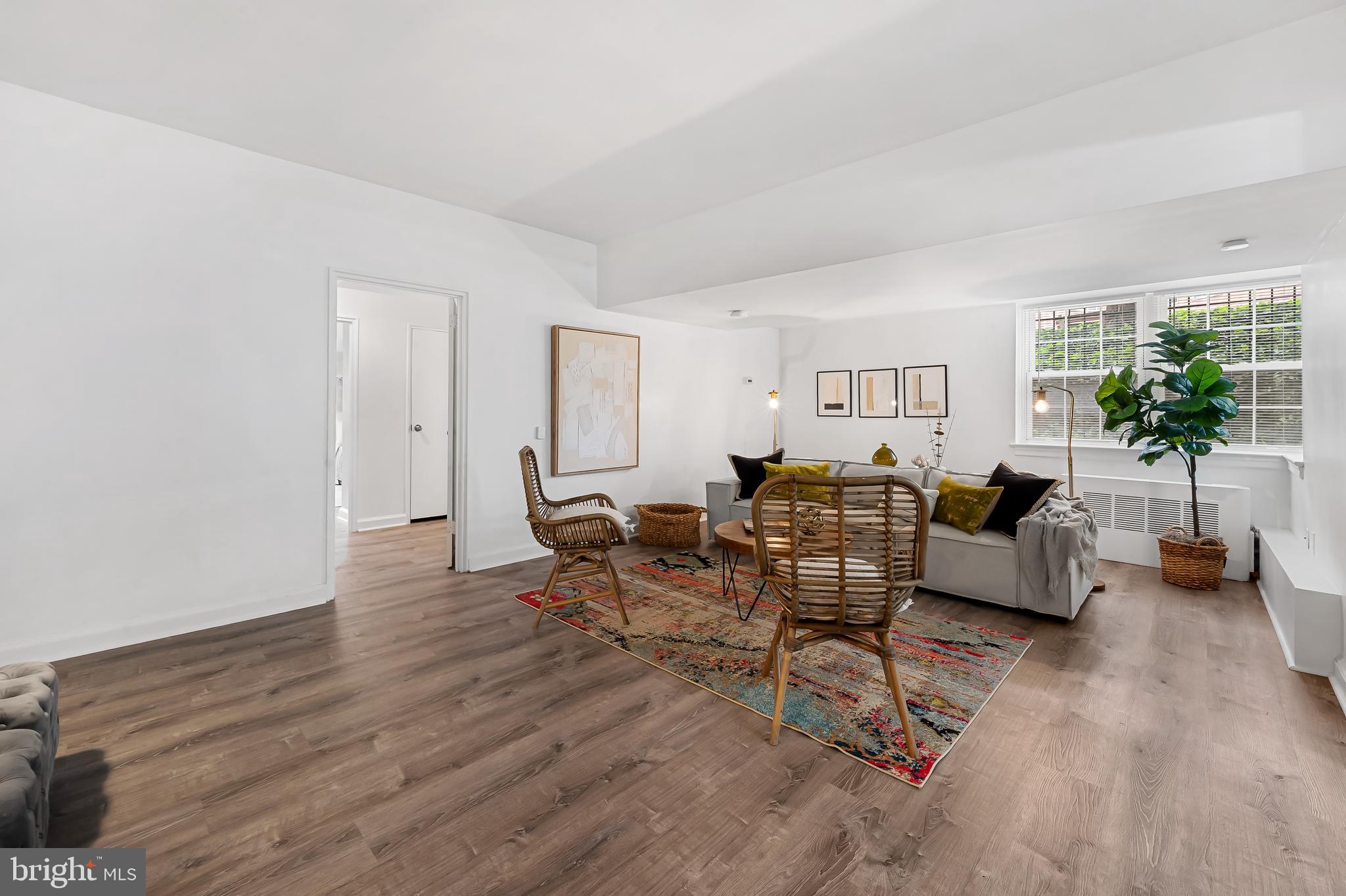 3601 Greenway, Unit 1 Baltimore, MD 21218 - Photo 7 of 29 a living room with furniture and a wooden floor