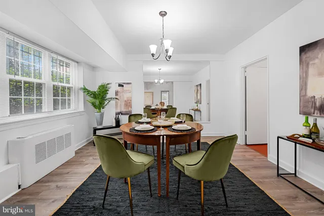a view of a dining room with furniture and window