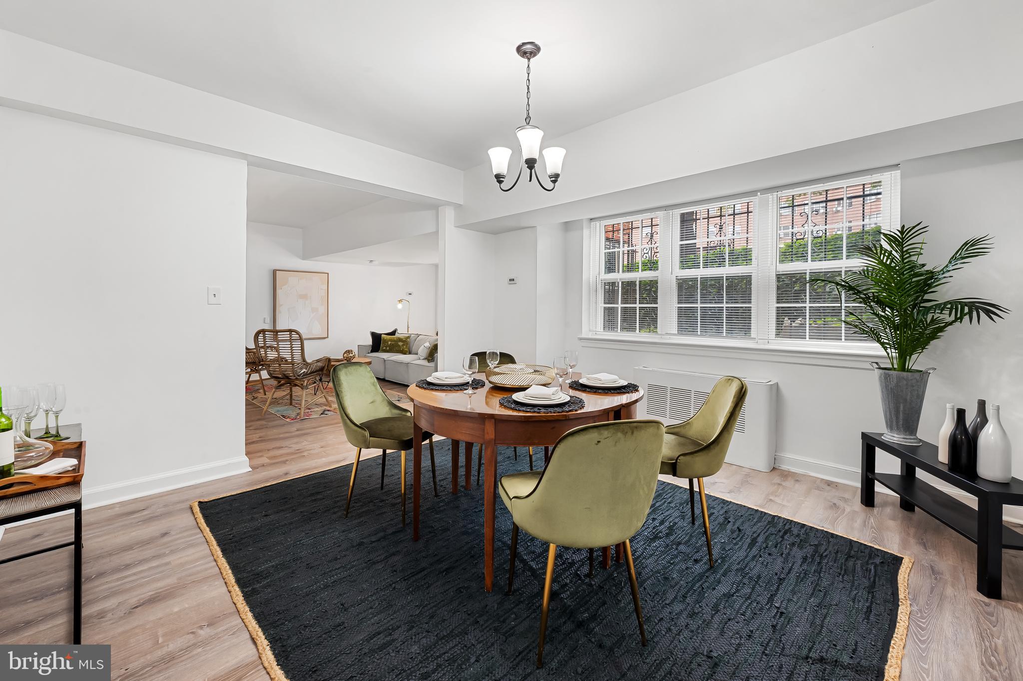 3601 Greenway, Unit 1 Baltimore, MD 21218 - Photo 10 of 29 a view of a dining room with furniture window and wooden floor
