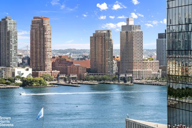 a view of lot of a city with tall buildings