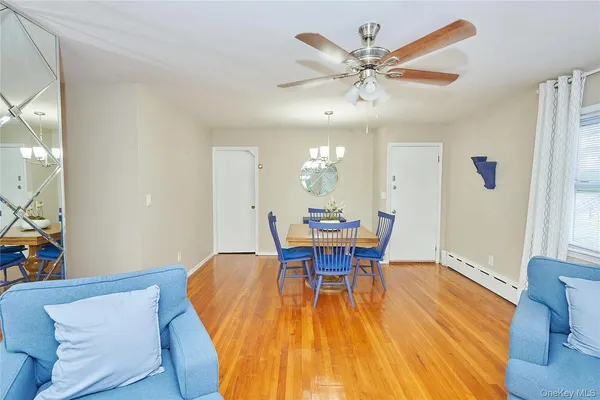 a dining room with furniture and window