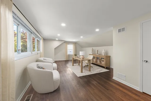 a living room with furniture and a table